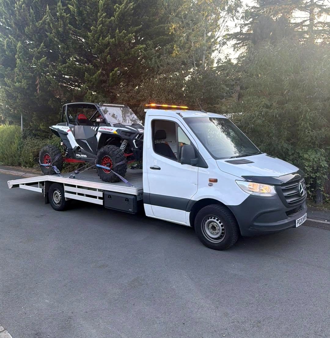 Polaris RZR strapped on the HC Recoverys flatbed